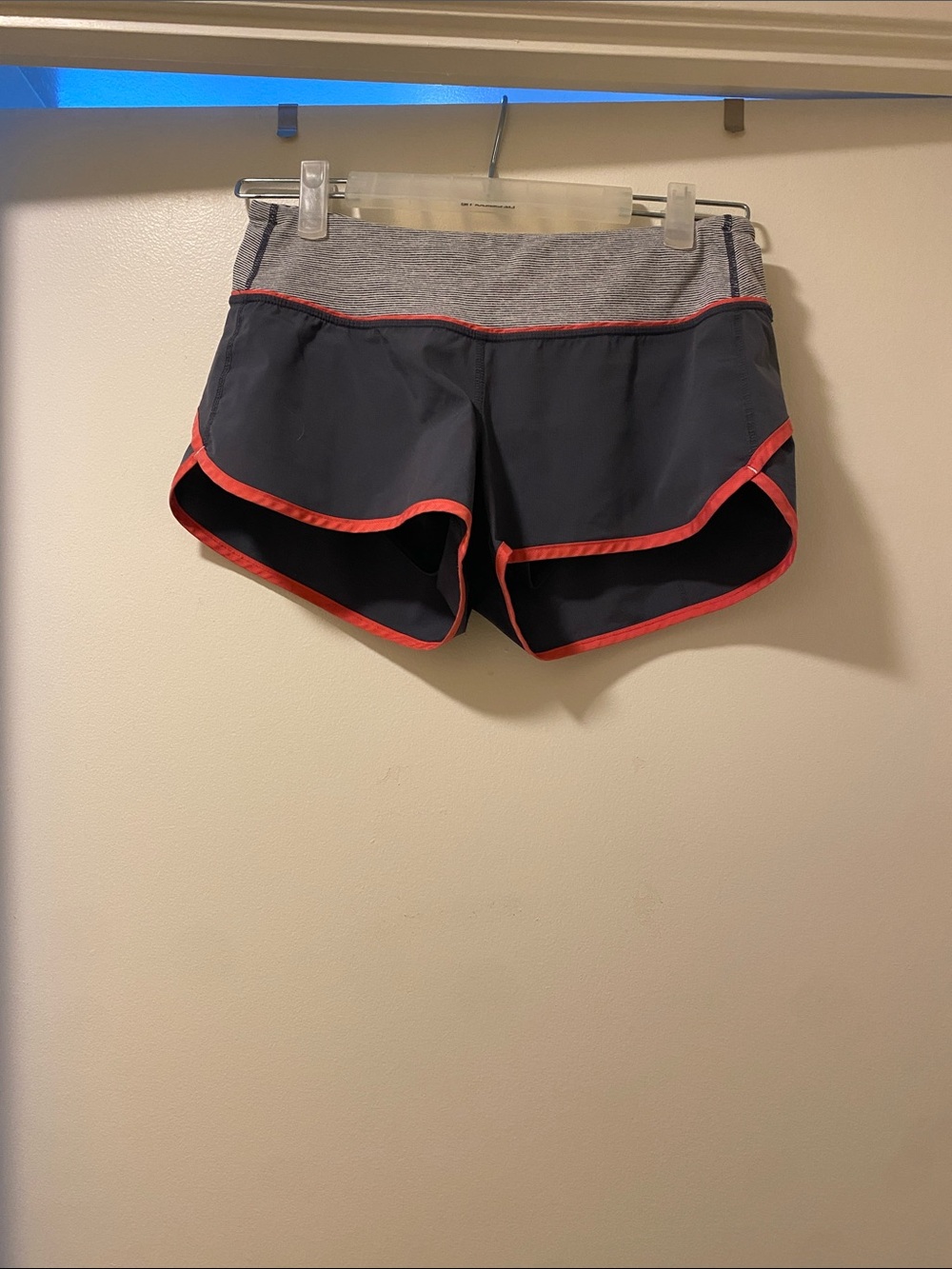 Authentic Lululemon Women's Gray and Coral Trim Athletic Shorts. Women’s size 4